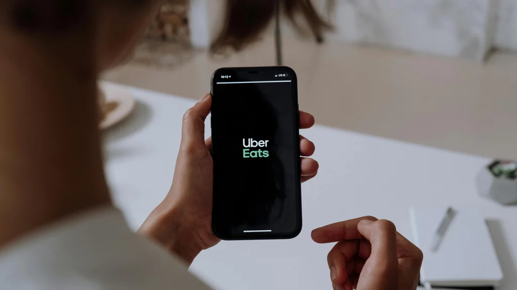 image of person using ubereats on their smrtphone